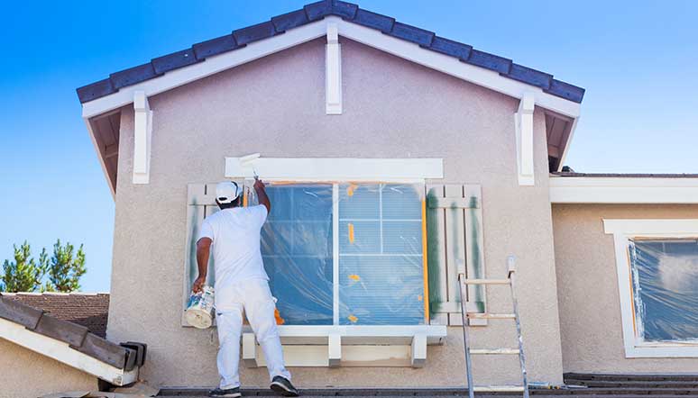 Man painting house