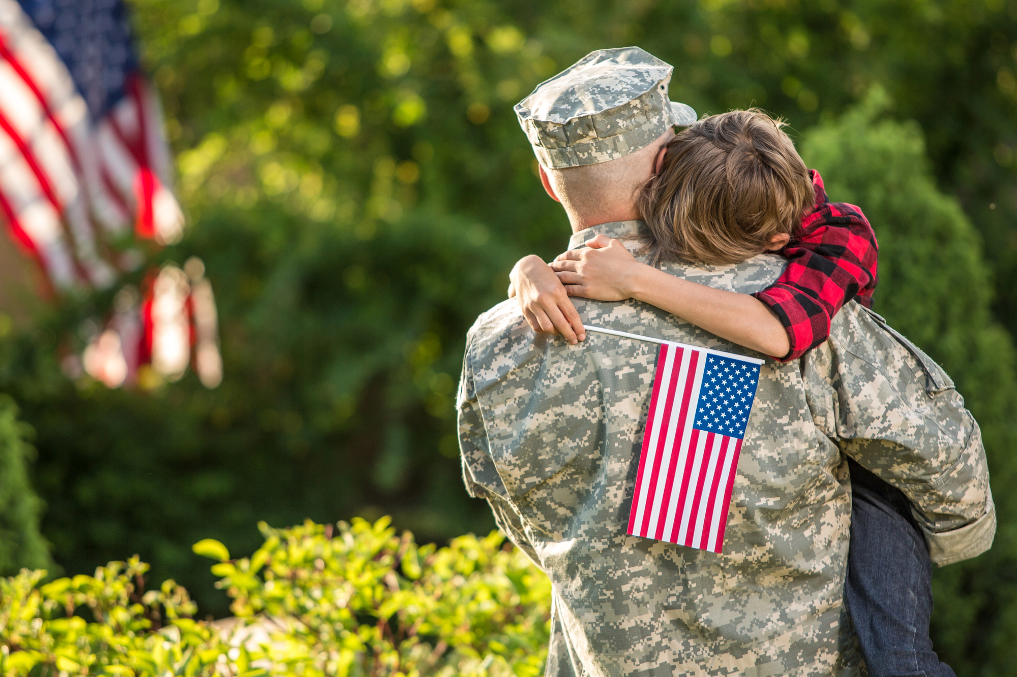 American soldier reunited with son on a sunny day