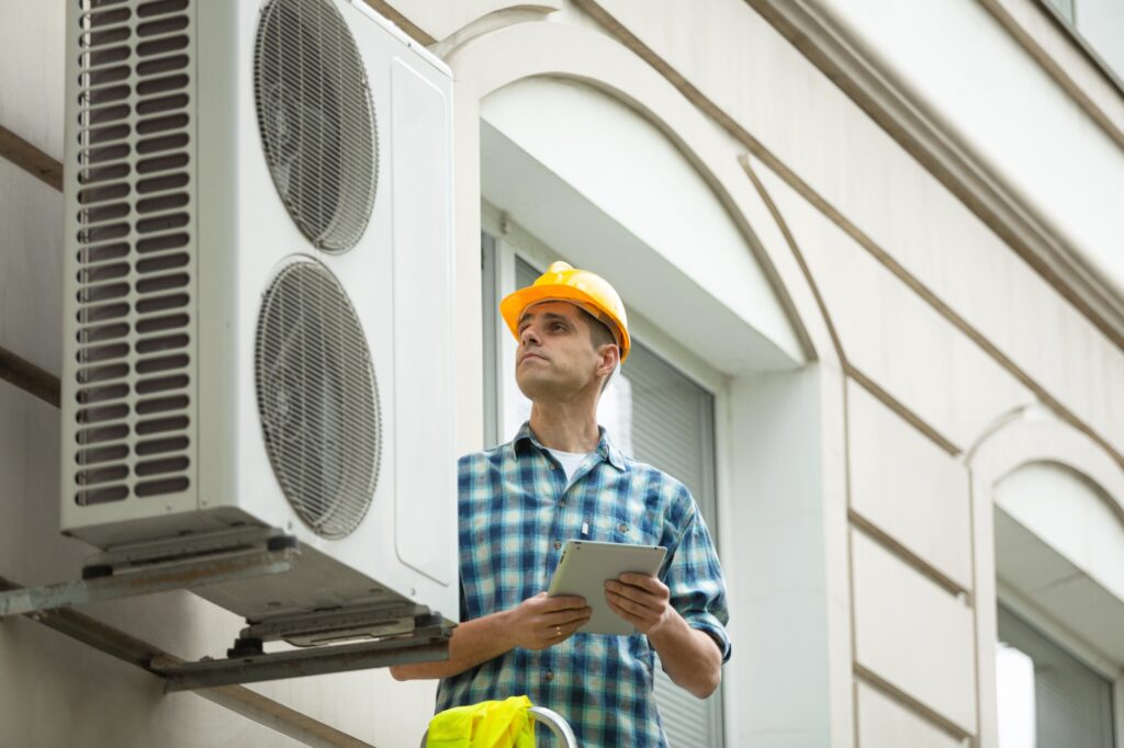 Technician worker repair Air Conditioning 