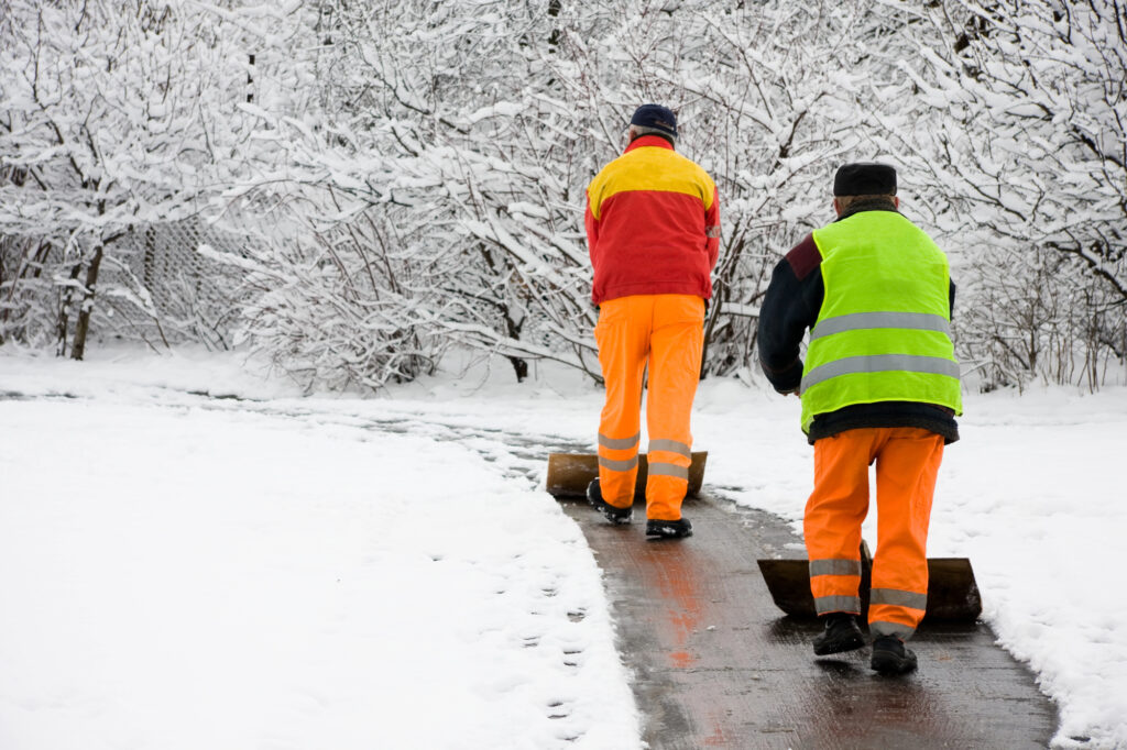 Workers removing first snow