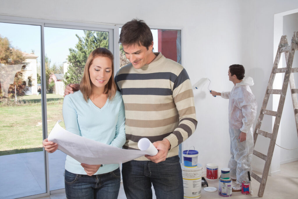 Couple going through house plan